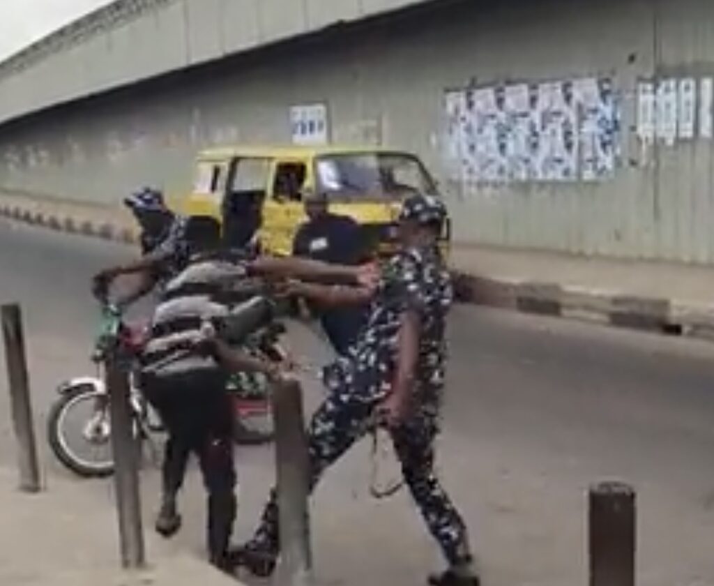 police brutalising the motorcyclist